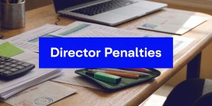 Director penalty notice concept with business documents, calculator and laptop on desk