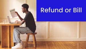 Person reviewing a tax document while using a laptop to estimate refund or tax bill for 2026