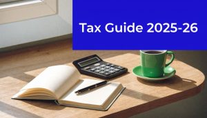 Tax guide 2025–26 with calculator, notebook and coffee on desk