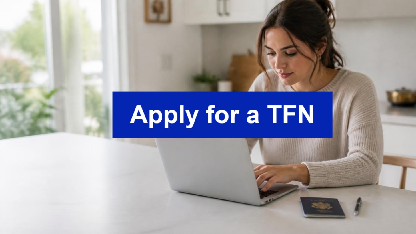 Woman completing an online form on a laptop with a passport beside her and an Apply for a TFN banner, illustrating how to apply for a tax file number