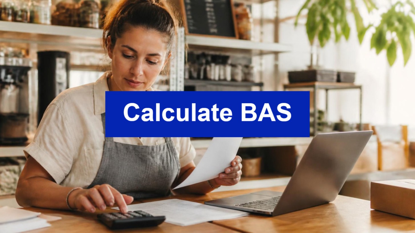 Calculate BAS - small business owner working through invoices with a calculator