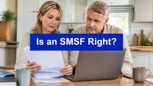 Couple reviewing paperwork at a laptop, illustrating whether an SMSF is right for them