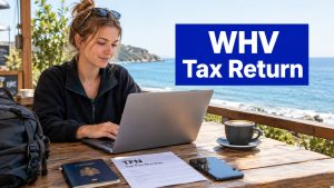 Working holiday maker at a seaside cafe preparing her WHV tax return on a laptop with her passport and TFN form